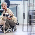 SNIPClinic vet tech and a dog